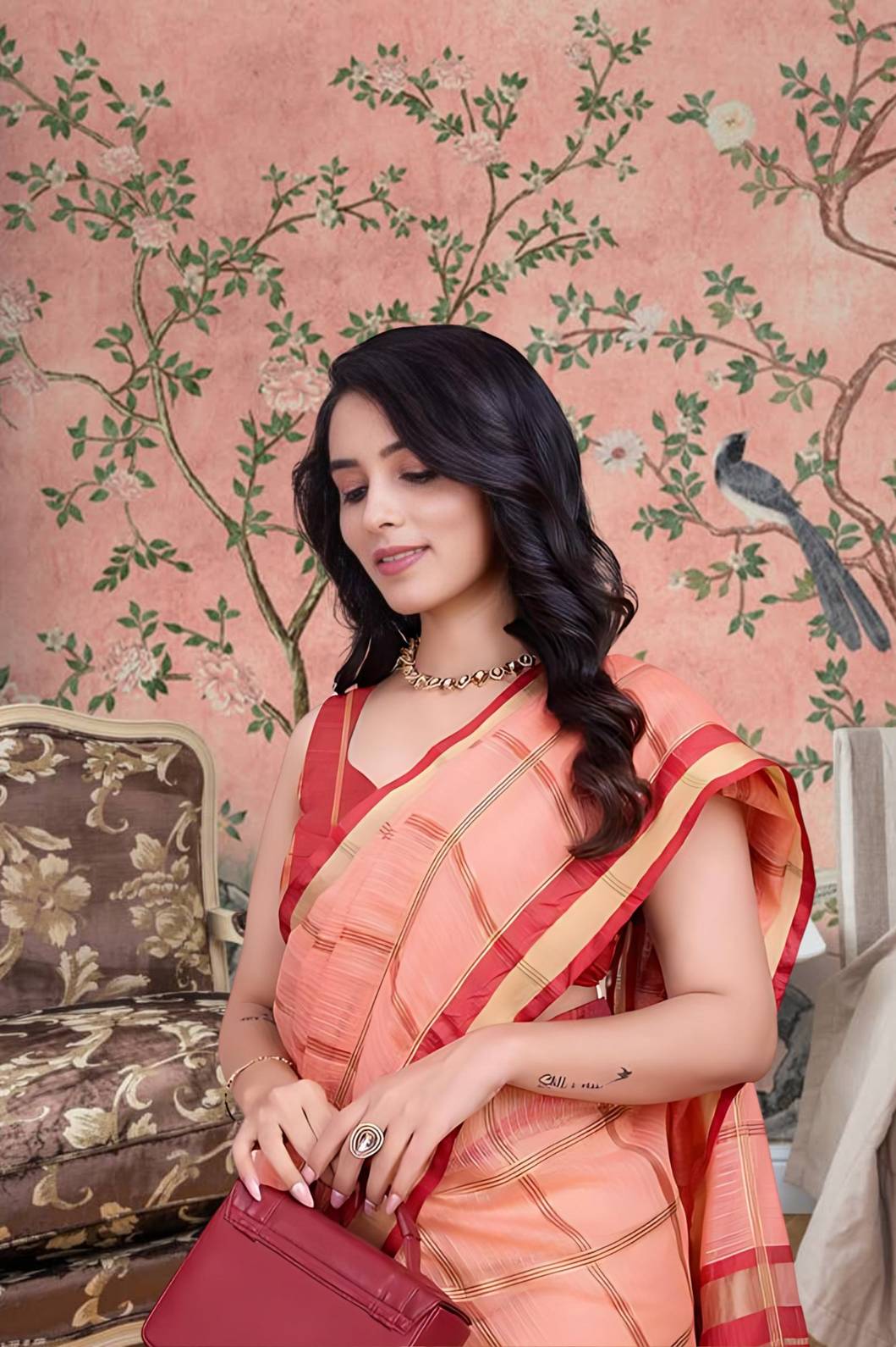 Front view of peach checkered saree glowing in royal ambiance