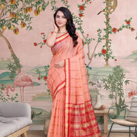 Front view of peach checkered saree glowing in royal ambiance