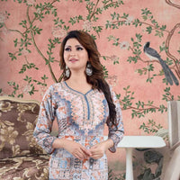 Front view of multicolor kurti against crumbling mural, sleeves catching confetti