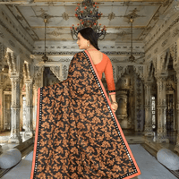 Model twirling: navy fabric with orange ombré, butterflies appearing