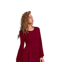 Flatlay of Crimson Aether Maroon dress showing shape and elegance