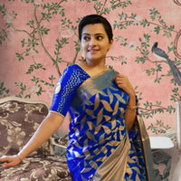 Front view of divine blue Litchi silk printed saree in temple-like palace setting