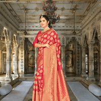 Detailed close-up of gold zari border work on deep wine Banarasi silk saree