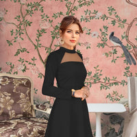Closeup of sheer neckline – soft contrast against bold black fabric