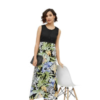 Sleeveless black-and-floral dress isolated on white, highlighting the dramatic color contrast