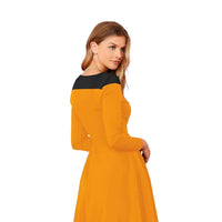 Back view of dress with full sleeves and stretchable knit fabric, cut out on white background.