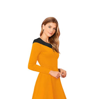 Close-up of black shoulder/collar contrast on yellow fabric, isolated on white.