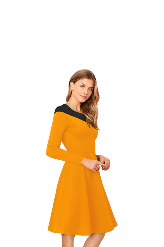 Close-up of black shoulder/collar contrast on yellow fabric, isolated on white.