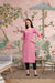  Front view of pink cotton straight kurti in elegant room