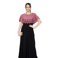 Studio front shot of sleeveless peach-black crepe gown