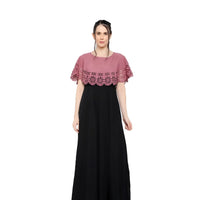 Studio front shot of sleeveless peach-black crepe gown
