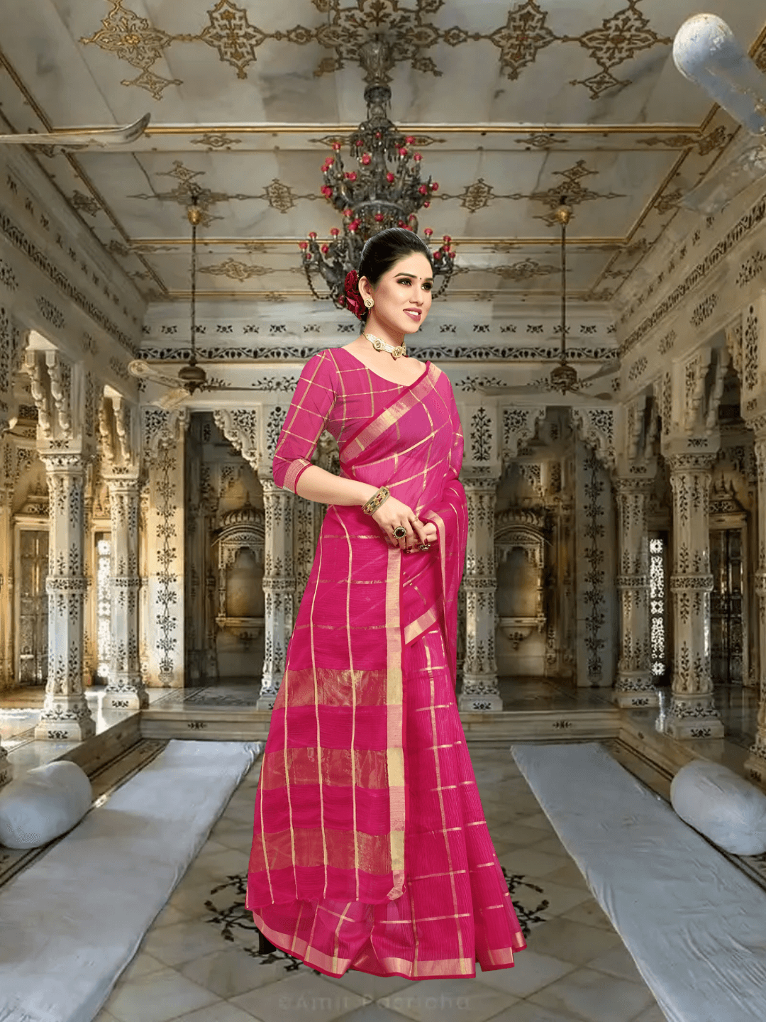 Close-up of blouse back design and pallu drape, red-pink harmony highlighted in traditional temple setting