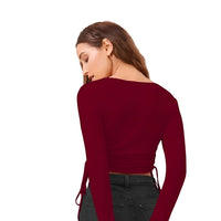 Studio back view of stretchable maroon top