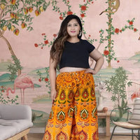 Front view of yellow Jaipur print palazzo pant in royal setting
