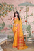  Front angle of yellow checkered saree glowing under palace light