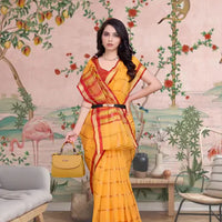  Front angle of yellow checkered saree glowing under palace light
