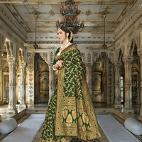 Model walking in deep green Banarasi saree under palace chandeliers