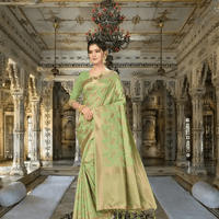 Close-up of golden borders on pista green handloom saree in palace backdrop