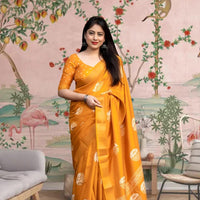 Front view of 💛 Hemavritta yellow cotton crape printed saree in a styled festive setup