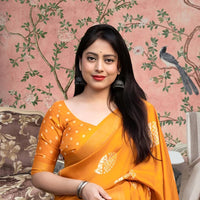 Front view of 💛 Hemavritta yellow cotton crape printed saree in a styled festive setup