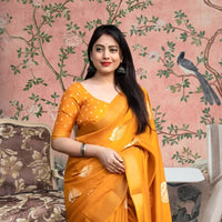 Front view of 💛 Hemavritta yellow cotton crape printed saree in a styled festive setup