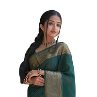 Studio front pose of green Lichi silk saree with neat draping – white background