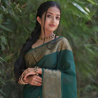 Front view of 💚 Hiranyasnehi green Lichi silk saree draped gracefully – lifestyle background