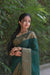 Front view of 💚 Hiranyasnehi green Lichi silk saree draped gracefully – lifestyle background