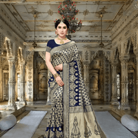 Model walking down palace corridor, pallu flowing like silk poetry with intricate gold threads