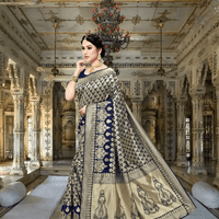 Navy blue saree glowing beneath royal chandeliers, golden jacquard patterns adding regal charm