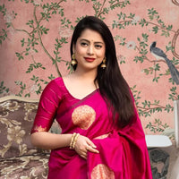 Front view of pink silk printed saree in royal setting