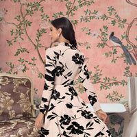 Rear view of cream printed V-neck dress