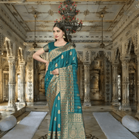 Emerald saree in monsoonal light, gold borders cutting like lightning through vines