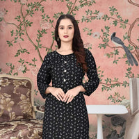  Front view of black rayon kurti against grey brick background