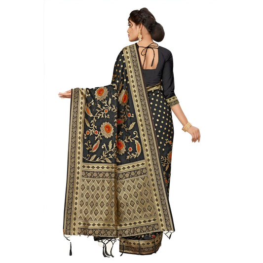 Extended view of intricate golden zari pallu on black silk in studio