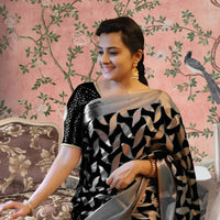 Front view of black Litchi silk printed saree in royal setting