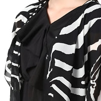 Closeup View of black printed women’s shrug by CELESTINA