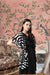 Front view of black printed women’s shrug by CELESTINA