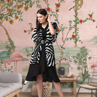 Front view of black printed women’s shrug by CELESTINA
