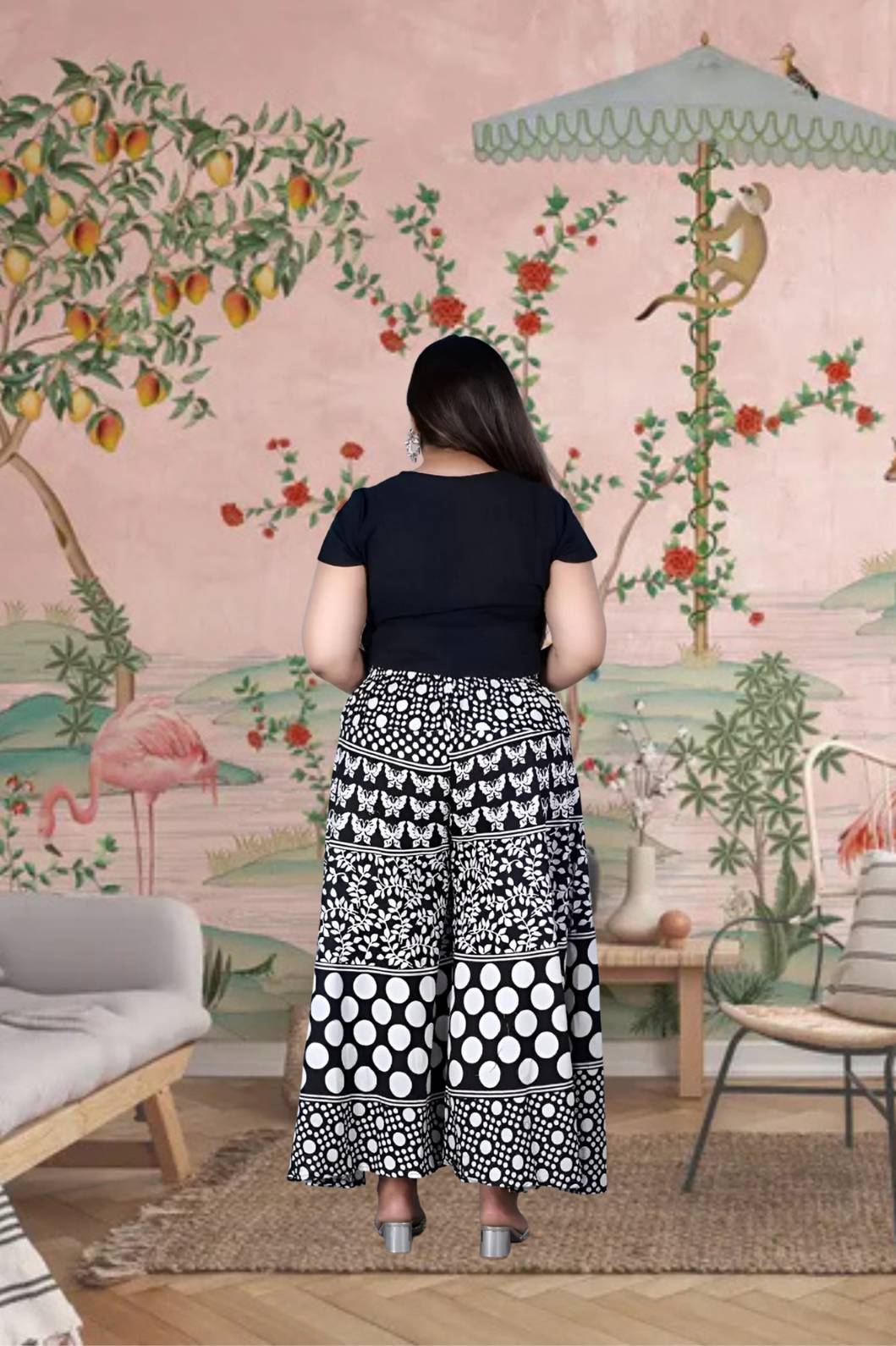 Rear silhouette of palazzo revealing gathered drape in motion