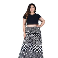 Front angle of printed black palazzo pants in isolation