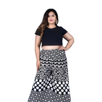 Front angle of printed black palazzo pants in isolation