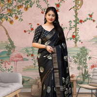 Front angle of black printed saree glowing in palace setting
