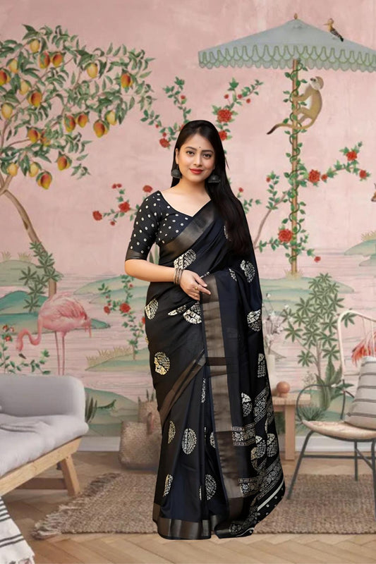 Front angle of black printed saree glowing in palace setting