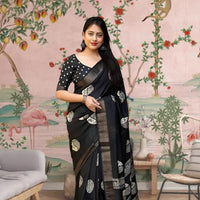 Front view of 🖤 Kaatyaayani black printed cotton crape saree – styled in ethnic setting