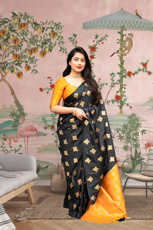  Front view of black silk saree with vibrant yellow blouse in royal palace room