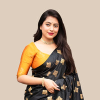 Studio front view of black silk saree with yellow blouse contrast