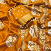 Studio close-up of yellow printed pallu and cotton crape texture