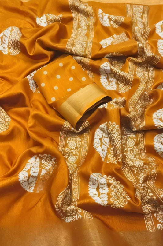 Studio close-up of yellow printed pallu and cotton crape texture