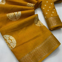 Studio close-up of yellow printed pallu and cotton crape texture